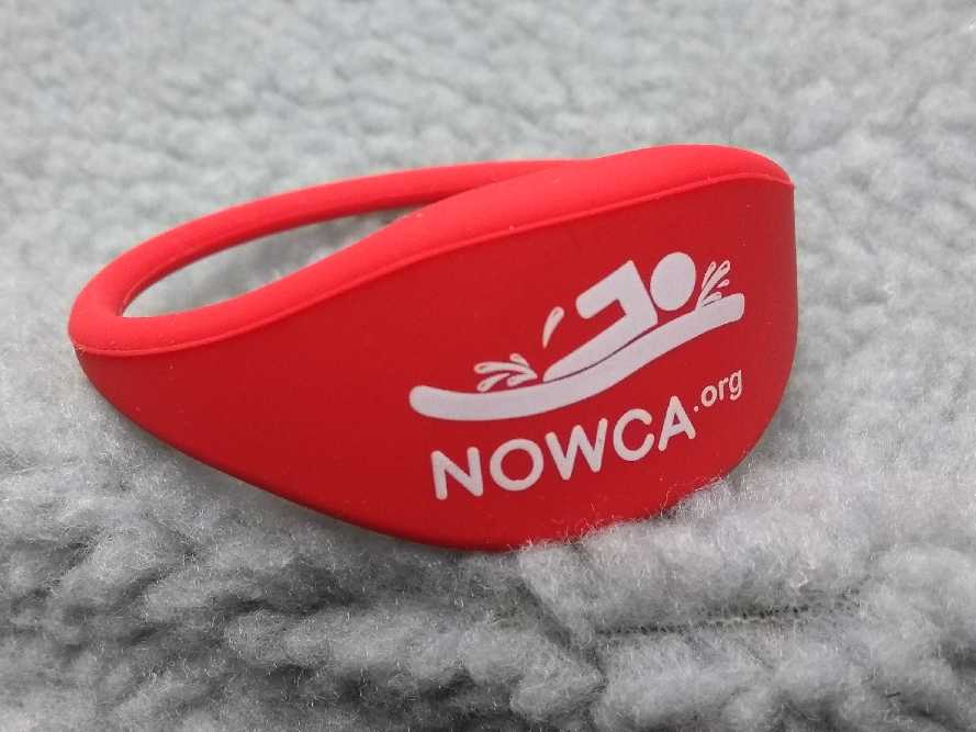 NOWCA band sat on the fluffy interior of a changing robe